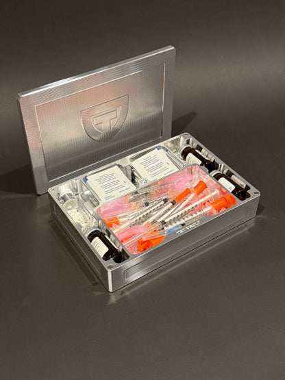 Raw machined TRT Vault Mega shown open with syringes, vials, alcohol pads, and storage supplies.