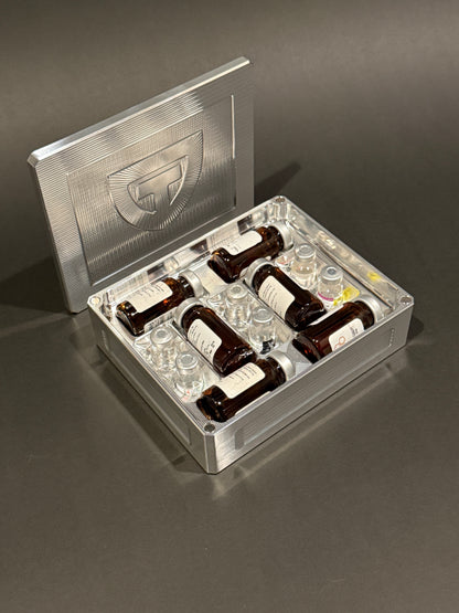 Raw machined aluminum Peptide Vault Mini shown open and loaded with large and small peptide vials.