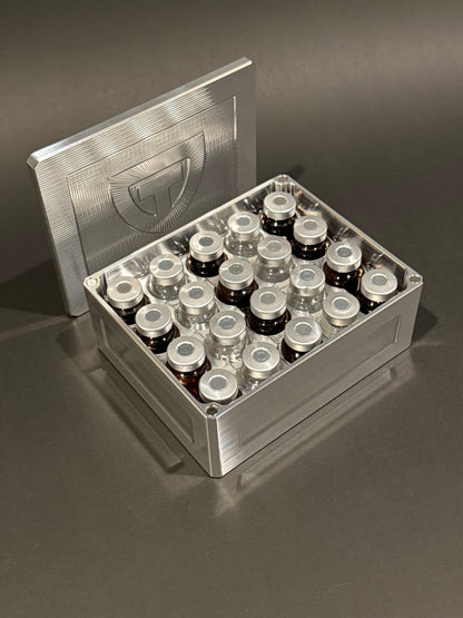 Open Vial Vault Mini in Raw Machined holding 20 vials upright, with the removable magnetic lid behind it.