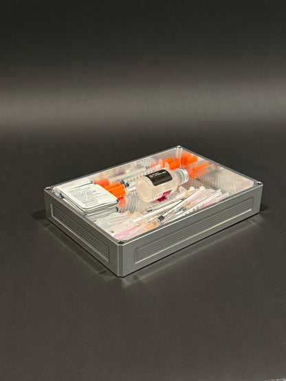 Raw machined Flex Vault Mega Lidless holding syringes, alcohol swabs and routine supplies.