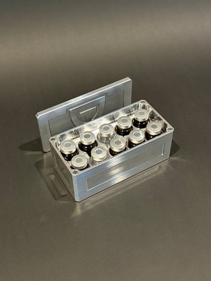 Open Vial Vault Micro in Raw Machined holding ten 5-10 mL vials upright, with the removable lid behind it.