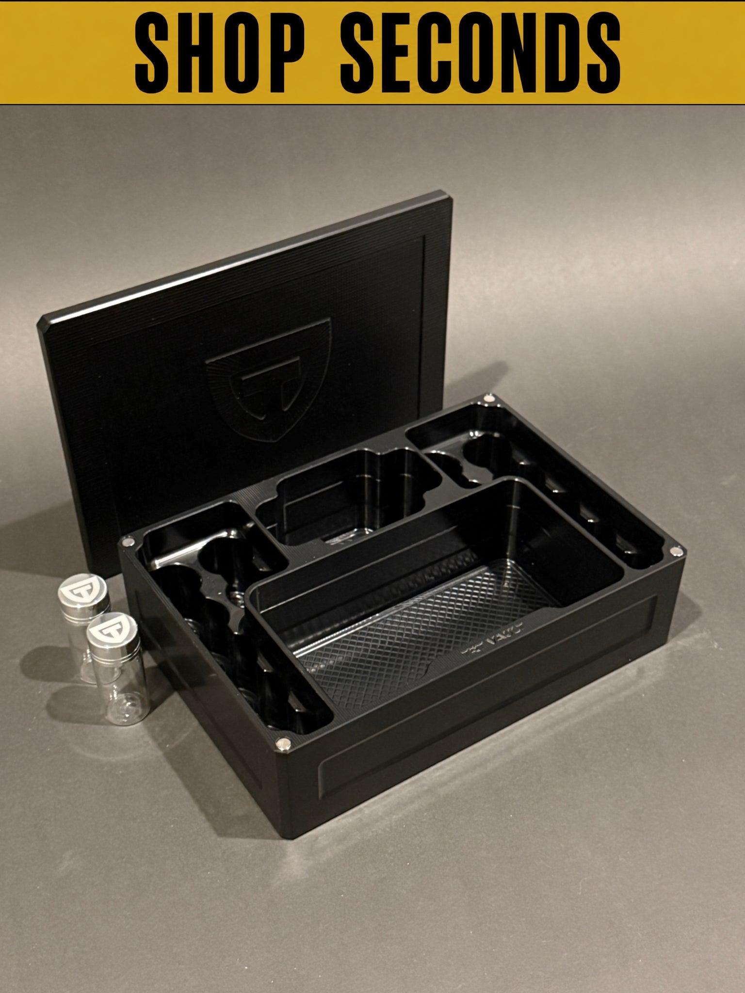 Shop Seconds black anodized Cycle Vault Mega shown open with magnetic lid and sample vials, displaying upright vial slots and large supply compartments.
