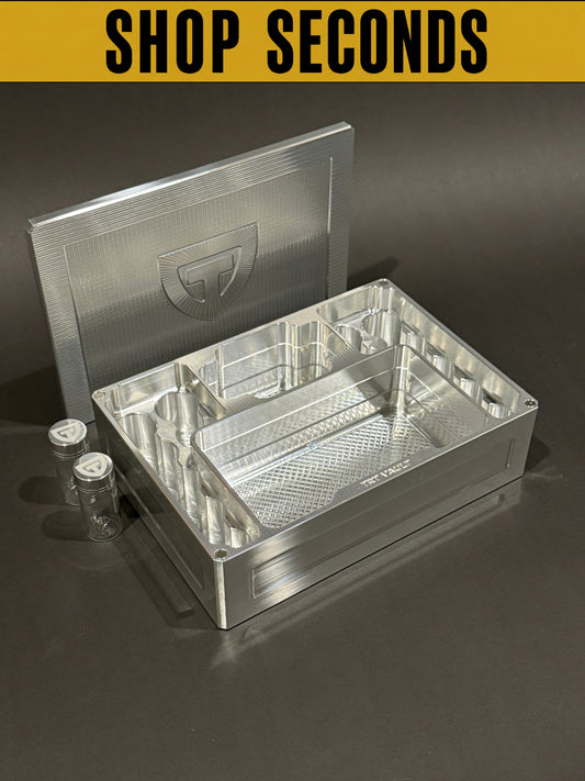 Shop Seconds Raw Machined Cycle Vault Mega shown open with its magnetic lid behind it and two included pill vials beside it.