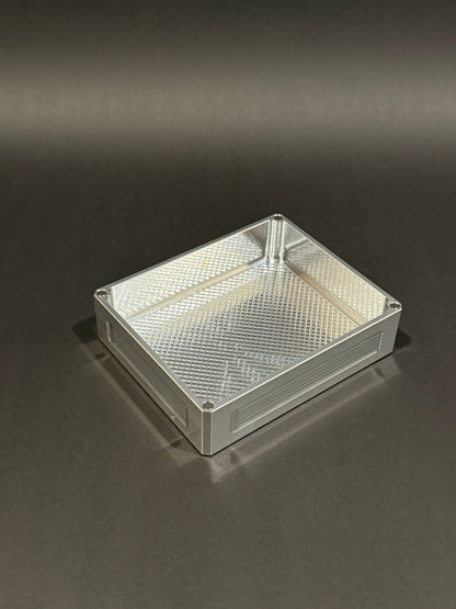 Raw machined Flex Vault Mini Lidless shown empty with a large storage compartment and textured interior.
