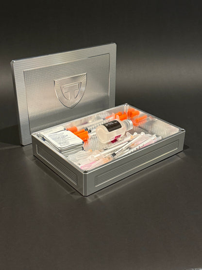 Raw machined Flex Vault Mega shown open and loaded with syringes, alcohol wipes, and injection supplies.