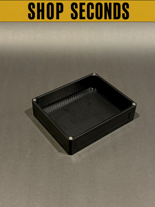 Shop Seconds anodized black Flex Vault Mini Lidless shown empty with a large storage compartment and textured interior.
