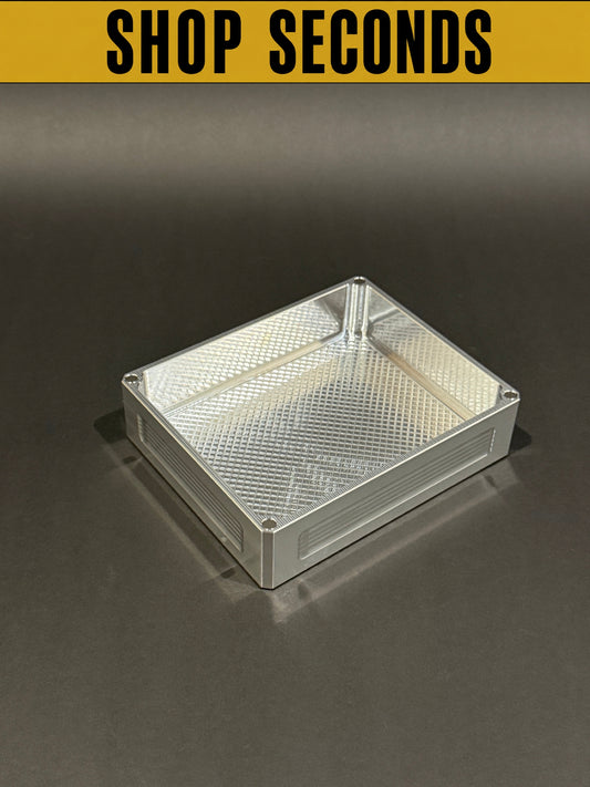 Shop Seconds raw machined Flex Vault Mini Lidless shown empty with a large storage compartment and textured interior.