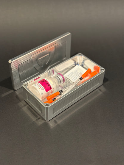 Raw machined Flex Vault Micro holding syringes, bacteriostatic water and alcohol swabs.