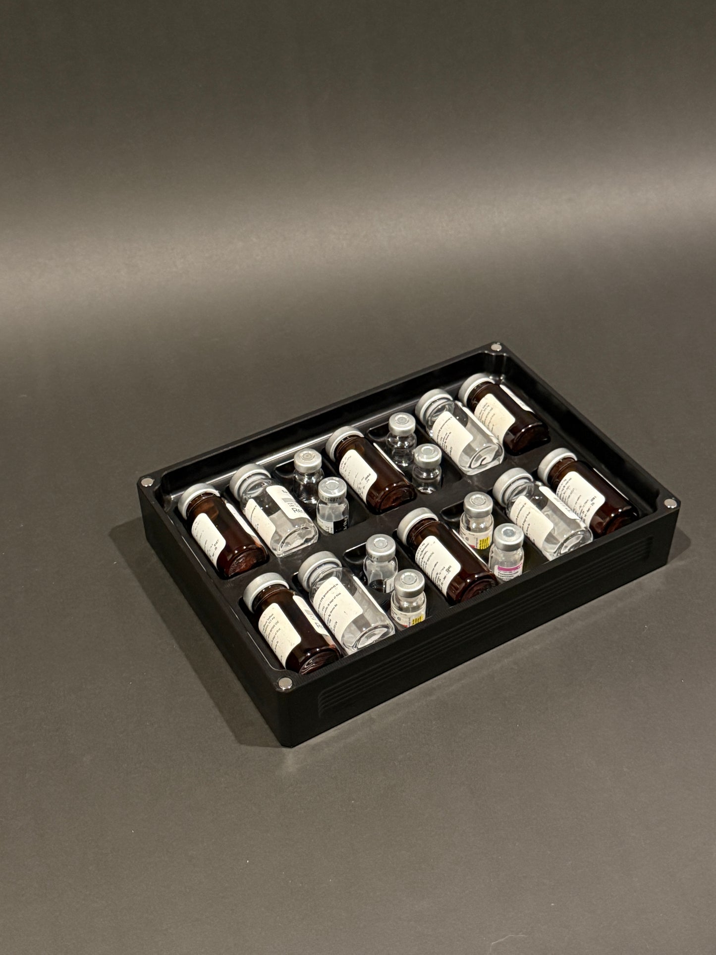 Peptide Vault Mega Lidless in Anodized Black holding vials