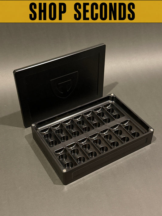 Shop Seconds anodized black Peptide Vault Mega shown open and empty with magnetic lid and precision-machined vial storage slots.