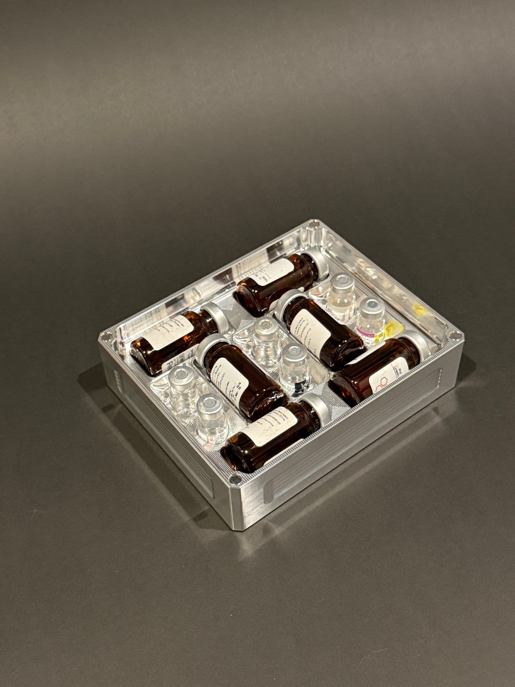 Peptide Vault Mini Lidless in Raw Machined holding small vials