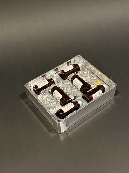 Peptide Vault Mini Lidless in Raw Machined holding small vials