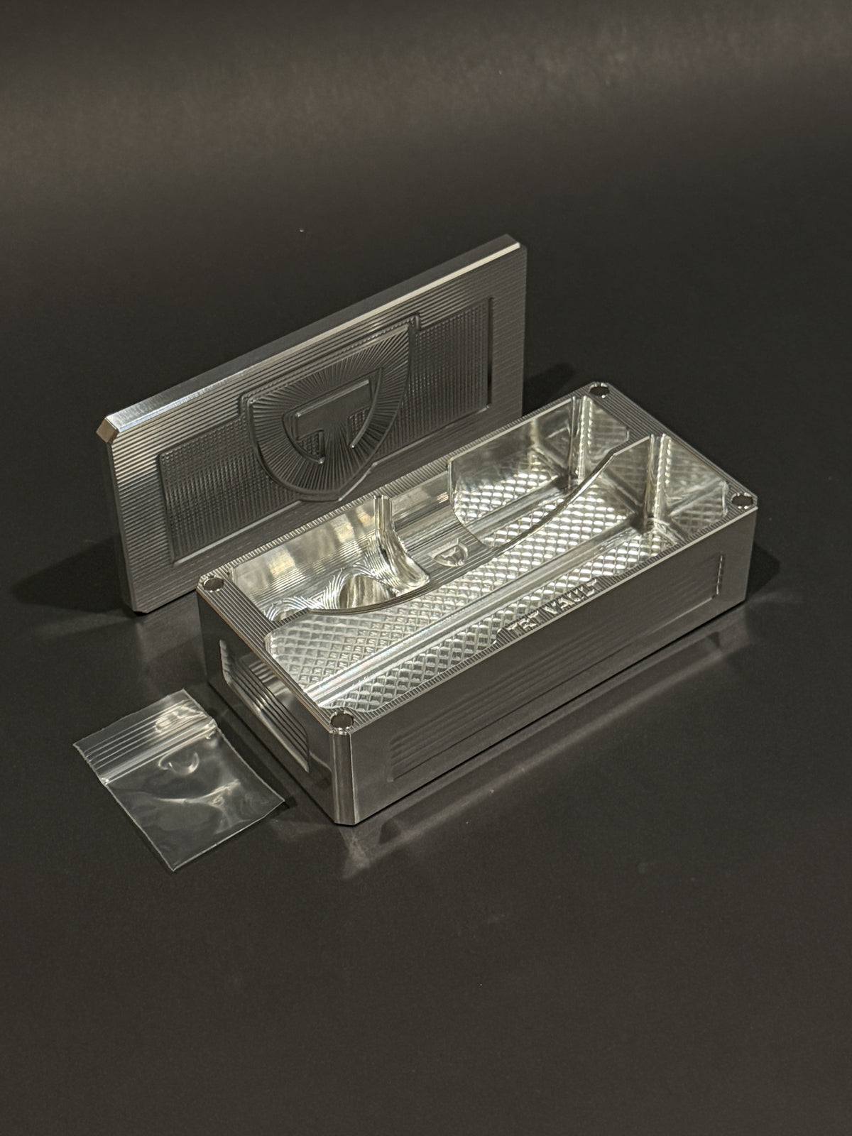 TRT Vault Micro in Raw Machined shown open with removable lid and included zip bag.