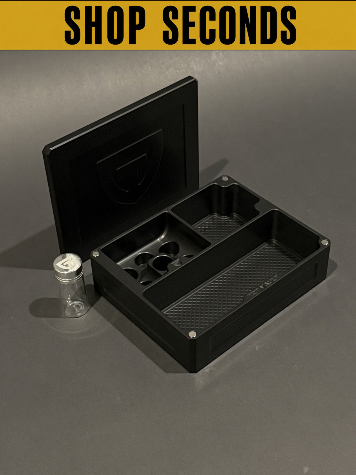 Shop Seconds TRT Vault Mini in Anodized Black shown open with removable lid and included 10 mL pill vial.