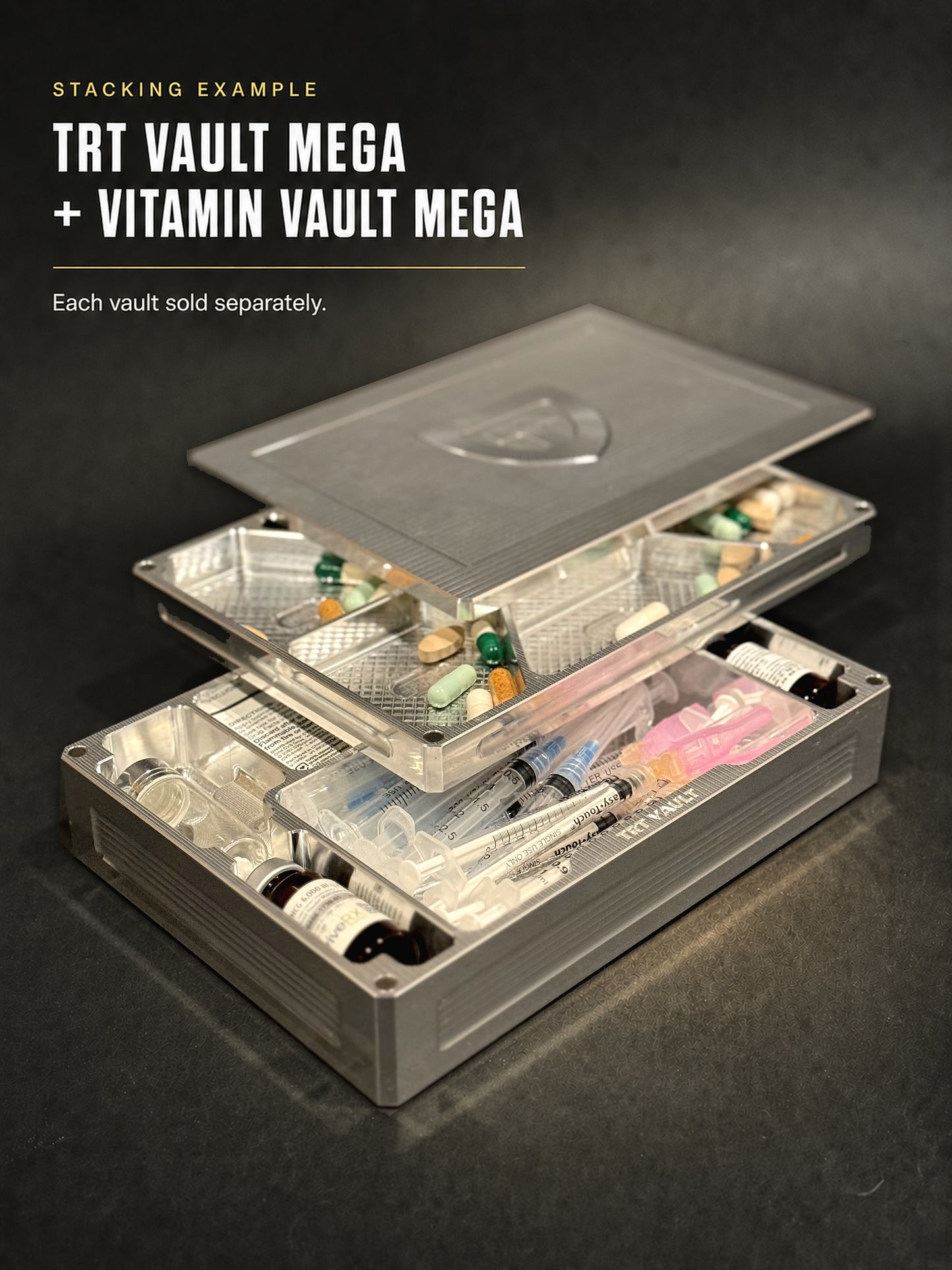 Open Raw Machined TRT Vault Mega with vials and syringes stacked beneath a Vitamin Vault Mega with pills; each vault sold separately