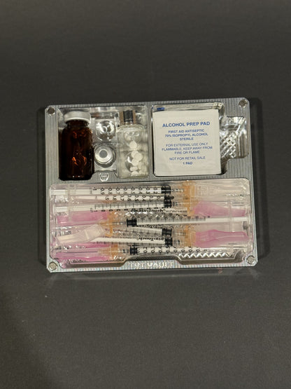 Open TRT Vault Mini in Raw Machined holding vials, syringes, alcohol swabs and pill vial.