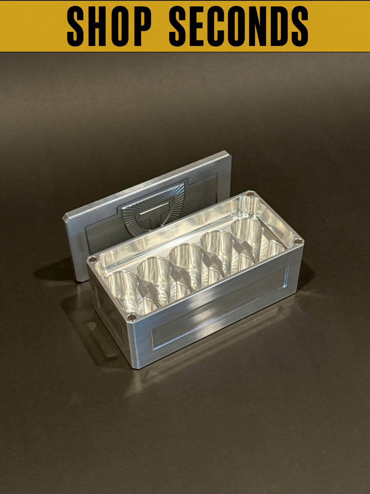 Shop Seconds Vial Vault Micro in Raw Machined shown open and empty with removable lid and 10 upright vial storage slots.