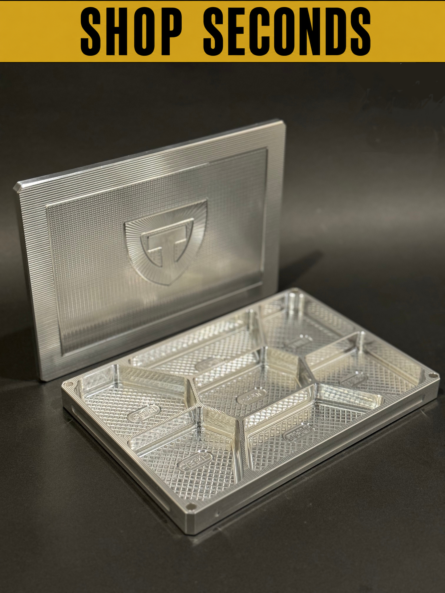 Shop Seconds raw aluminum Vitamin Vault Mega shown open and empty with divided weekly storage compartments and lid.