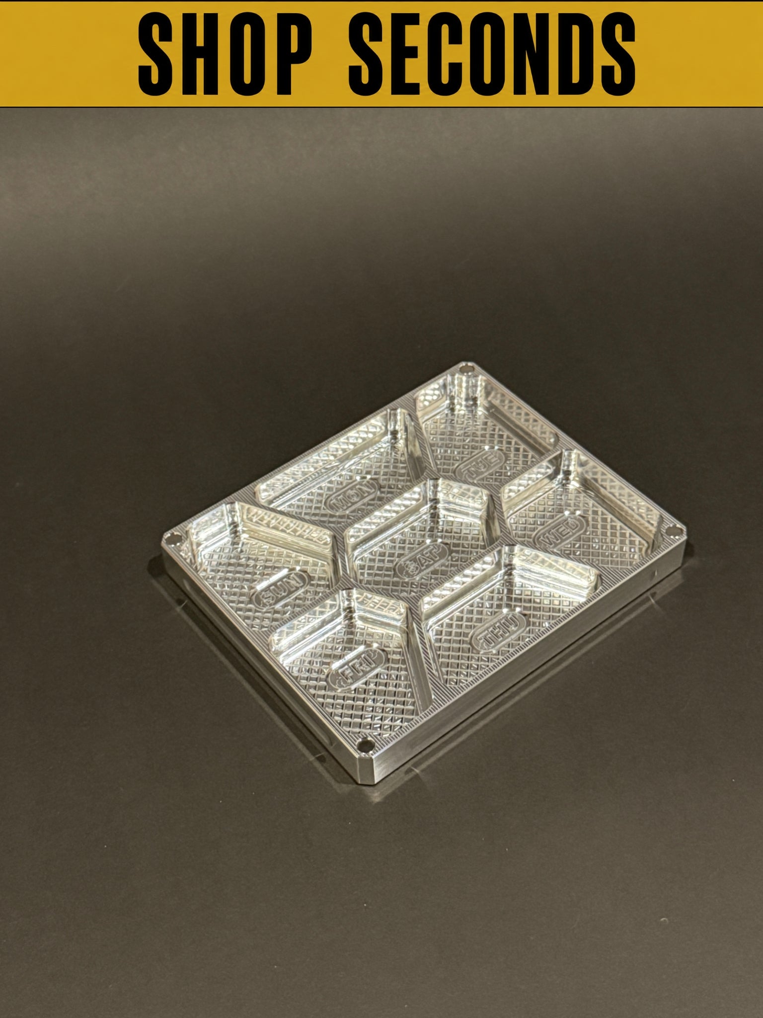 Shop Seconds raw machined Vitamin Vault Mini Lidless shown empty with seven individual storage compartments.