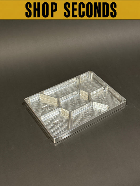 Shop Seconds raw machined Vitamin Vault Mega Lidless shown open and empty, displaying divided weekly storage compartments.