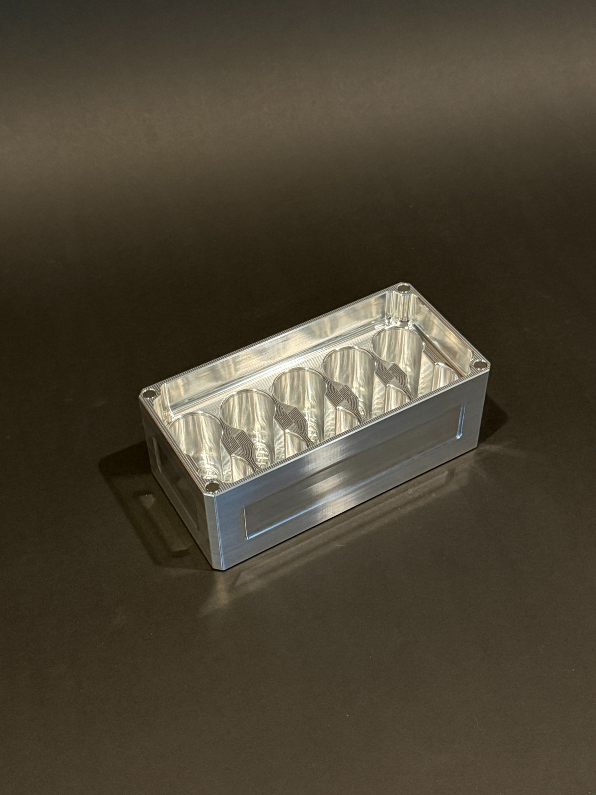 Lidless Vial Vault Micro in Raw Machined, shown empty with precision-machined upright vial storage slots.