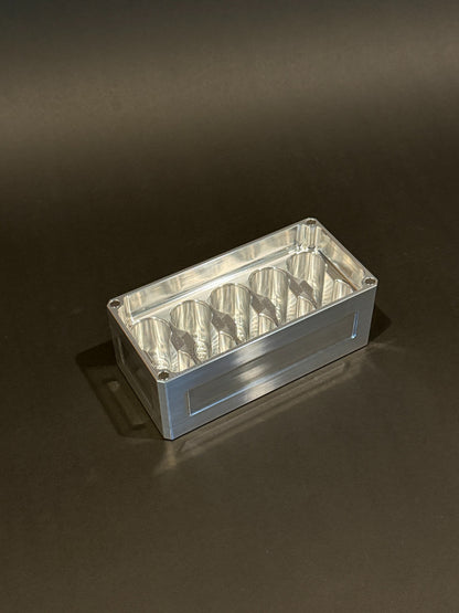 Lidless Vial Vault Micro in Raw Machined, shown empty with precision-machined upright vial storage slots.