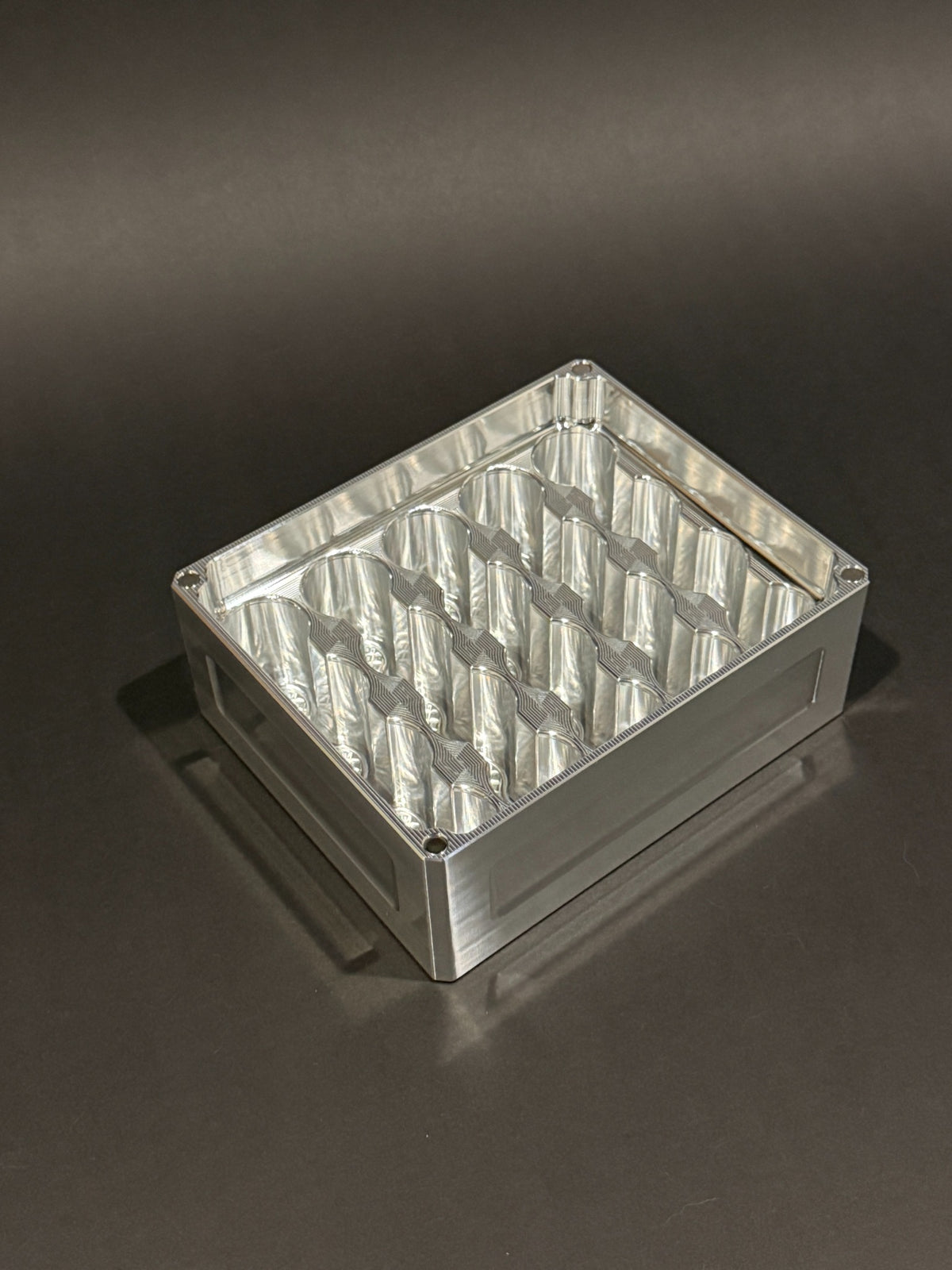Lidless Vial Vault Mini in Raw Machined, shown empty with precision-machined upright vial storage slots.